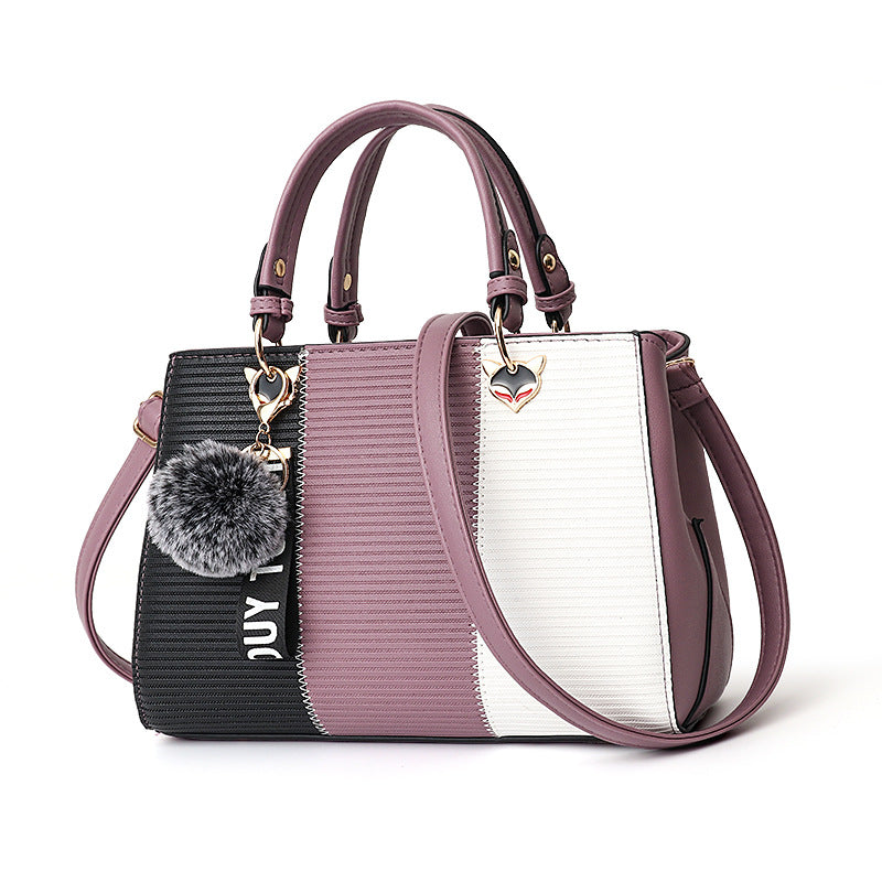 Fargeblokkveske med pompong