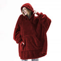 Oversized teppegenser med hette i grå