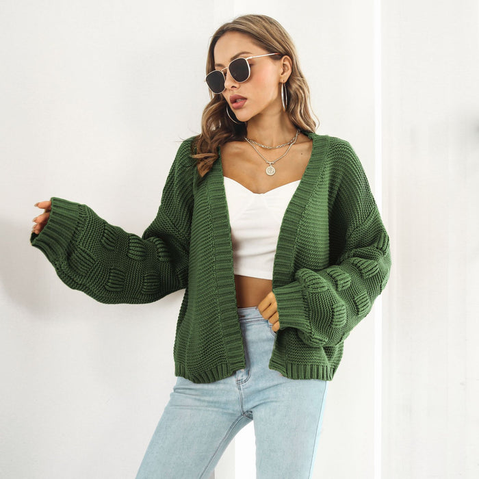 Ingrid | Grovstrikket cardigan med puffermer og kort snitt