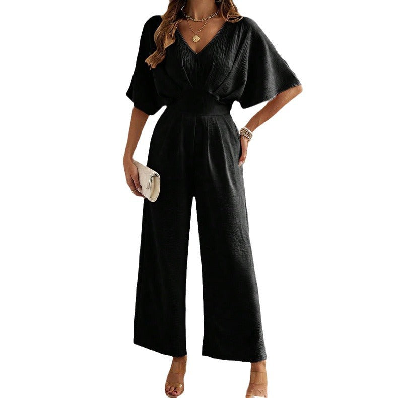 Dame Vid Jumpsuit med Elegant Drapering og V-hals