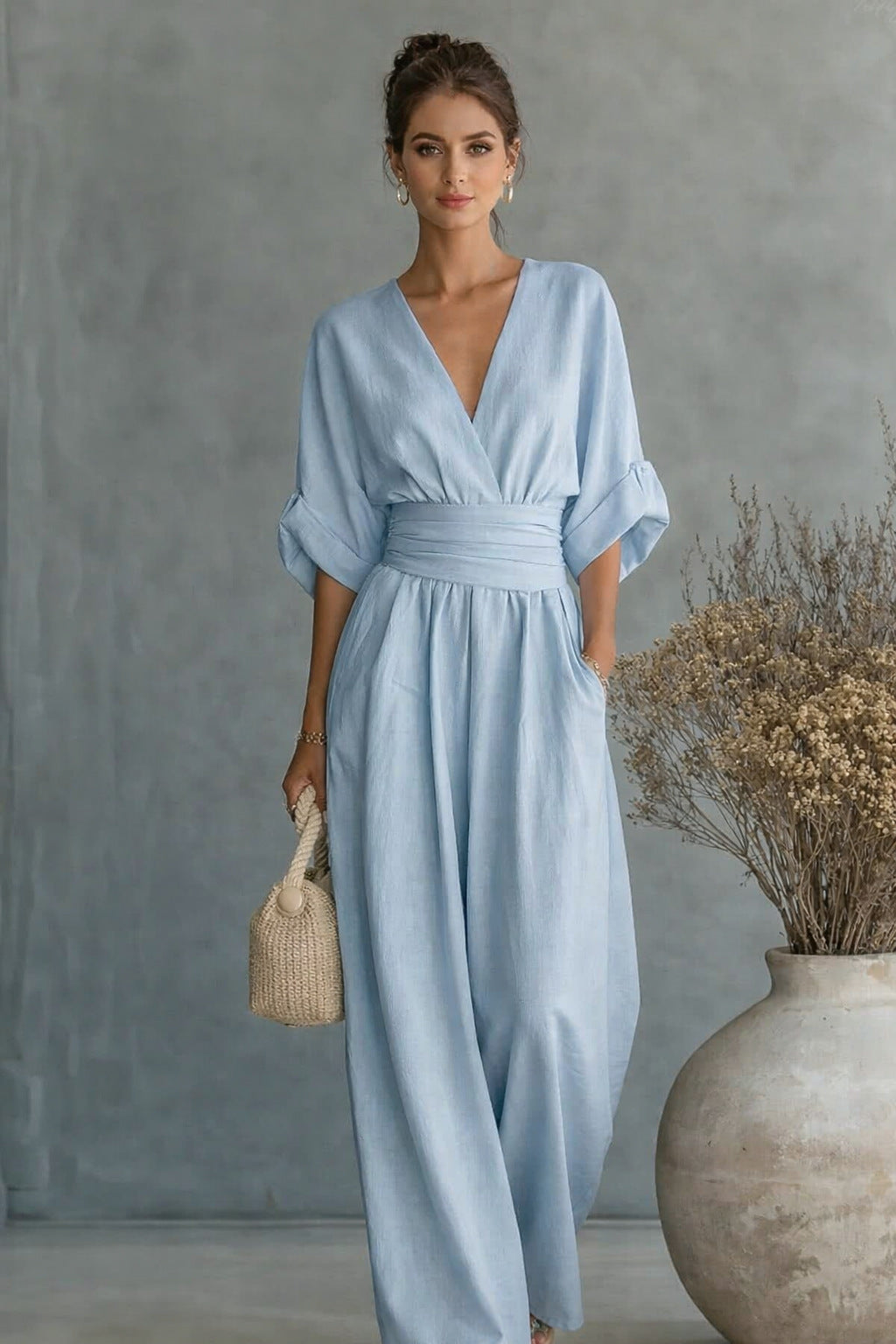 Dame Vid Jumpsuit med Elegant Drapering og V-hals