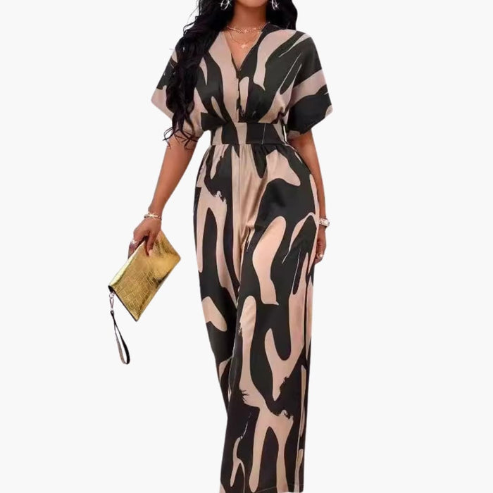 Kvinnens trykte bredbente jumpsuit med V-hals og midjebelte
